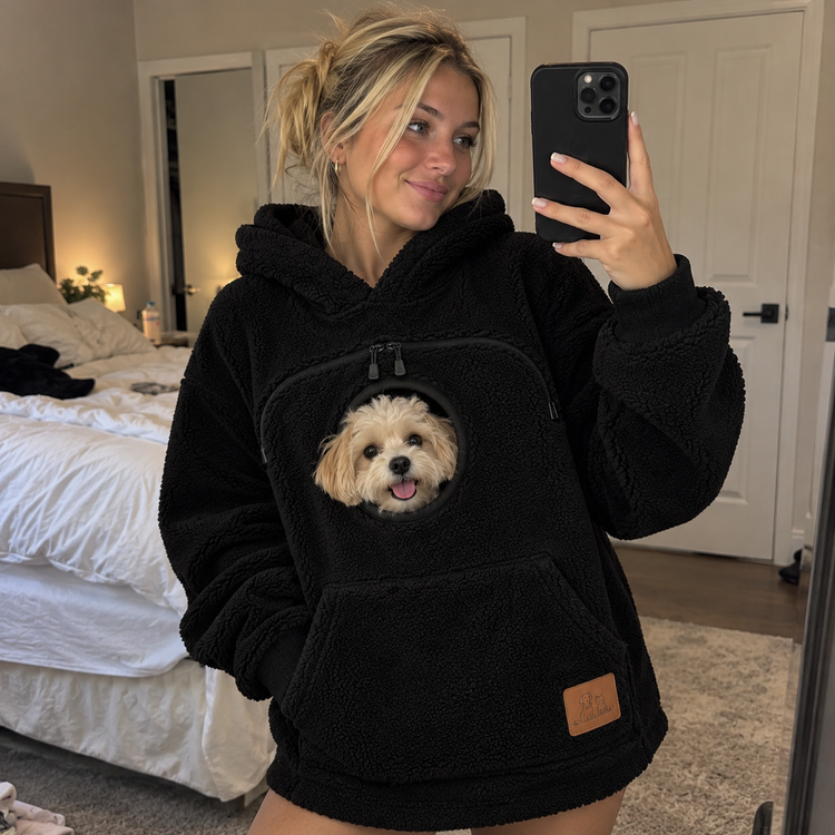 Customer wearing the Doggy Pocket Hoodie with their dog
